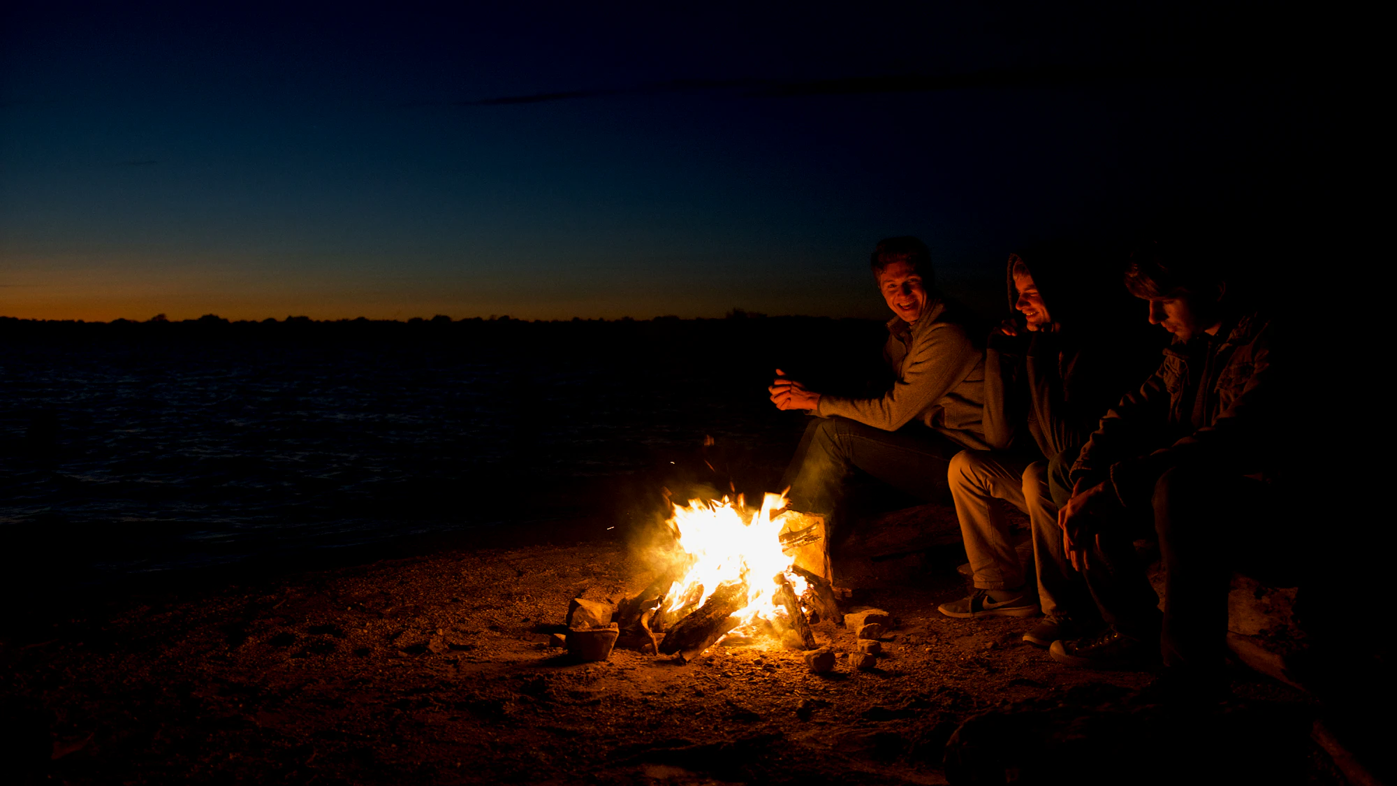 Friends spending time together around a fire